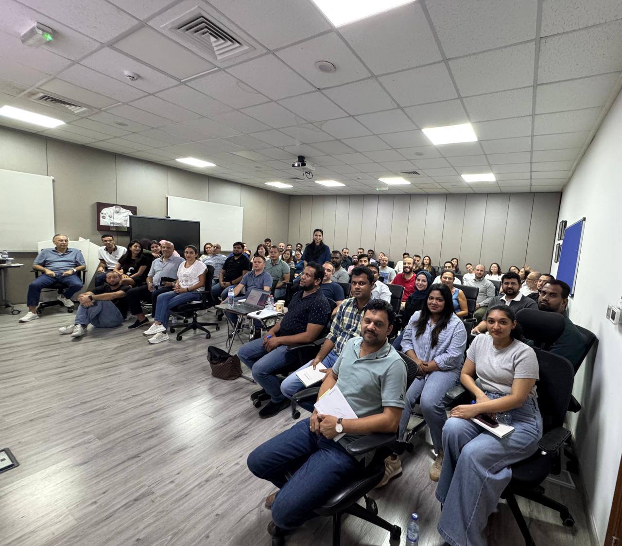 Priyanka with a large room of professionals during an AI training session